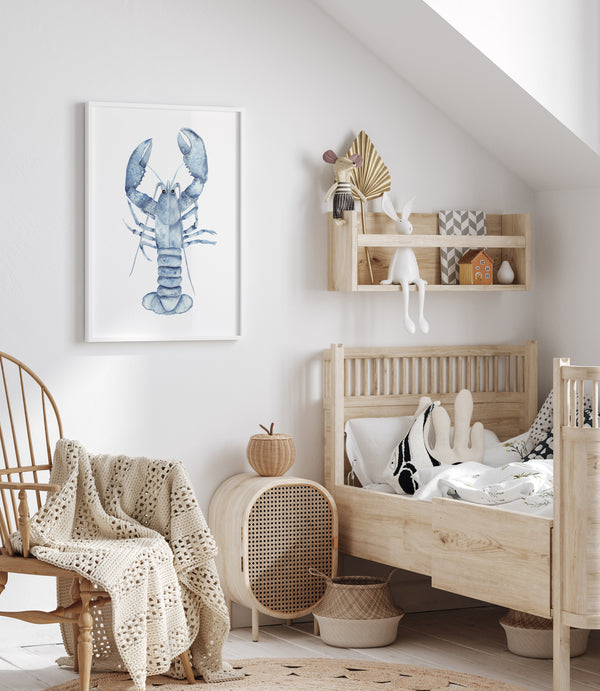 A framed watercolor painting showcases the intricate details of a blue lobster, its textured shell and powerful claws rendered with delicate precision, creating a whimsical and inviting atmosphere in a child's bedroom with a wooden bed, a rocking chair, and shelves filled with toys.