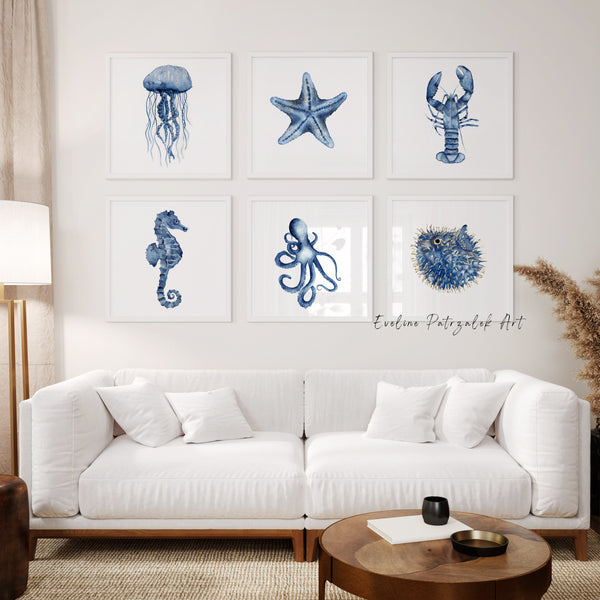 Living room with white sofa and wall art featuring blue ocean creatures.