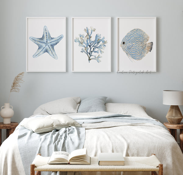 Bedroom with coastal-themed wall art  - set of 3 frames featuring a starfish, coral, and fish.