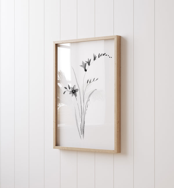 Set aus zwei minimalistischen botanischen Wandkunst-Drucken in Schwarz.