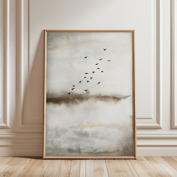 A watercolor painting evoking a sense of freedom and serenity. A flock of birds is depicted in flight against a backdrop of a misty landscape, conveying a feeling of boundless space and peaceful movement. The painting is in front of a white wall.