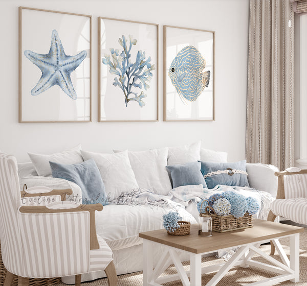 Living room with coastal-themed decor including starfish, coral, and fish prints on the wall.