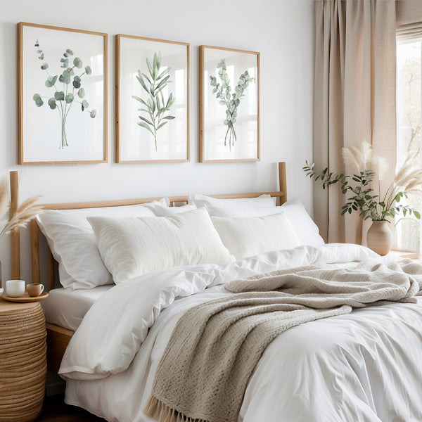 Neatly made bed with white bedding and beige blanket in a bedroom setting.