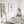Blue seahorse wall art in a bright white bathroom with a freestanding bathtub