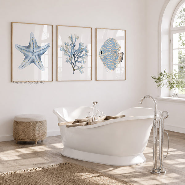 Bathroom with a freestanding bathtub, starfish, coral, and fish artwork on the wall.