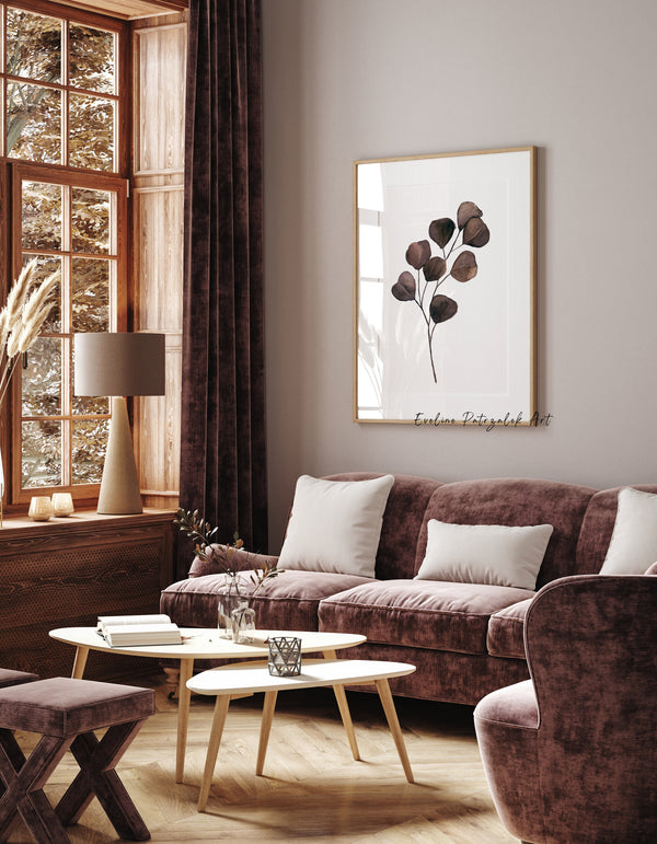 Brown eucalyptus print in a warm living room with burgundy velvet sofa