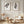 Brown eucalyptus wall art set of 2 on panelled wall with rattan chair and pampas grass