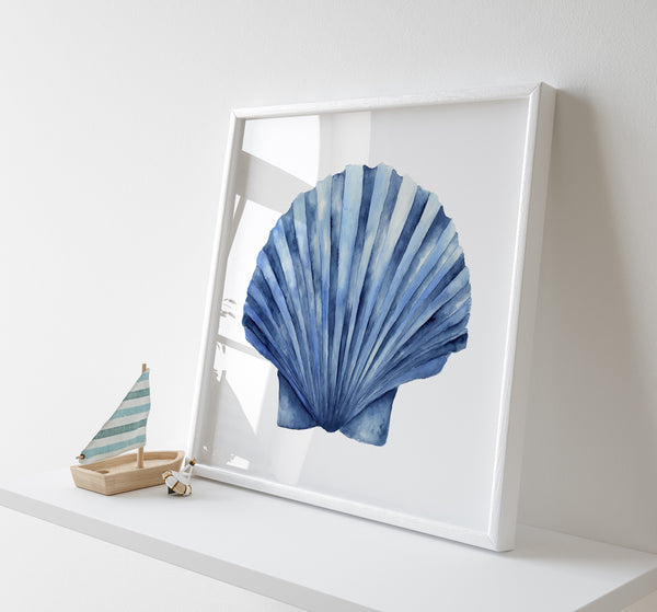 Framed artwork of a blue shell on a white surface with a small boat model.