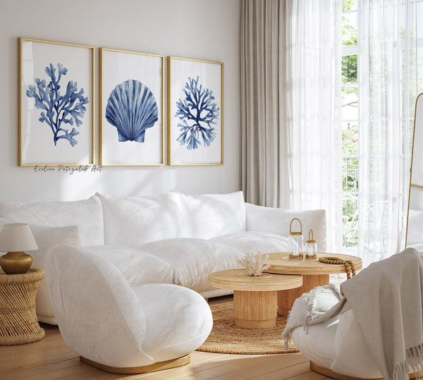 Modern living room with white sofa, armchair, and decorative wall art.