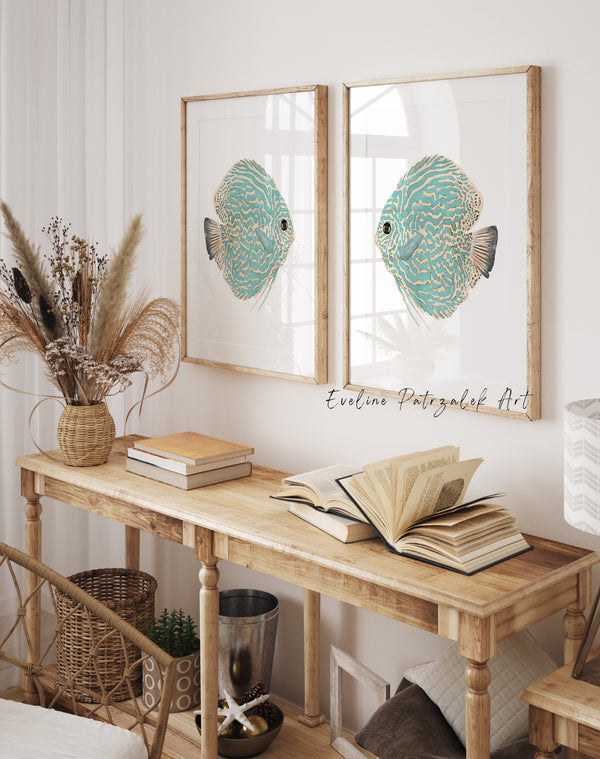 Wooden console table with decorative items and framed artwork of fish on a wall.