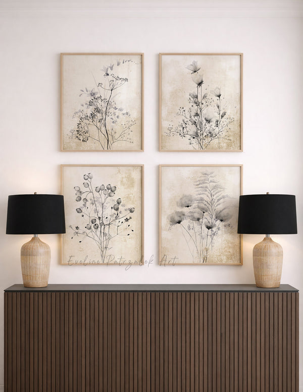 Decorative wall art with floral prints above a wooden console table with lamps.