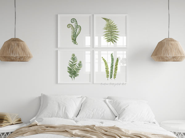 Bedroom with framed fern prints on the wall, two hanging lamps, and a book.
