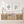 Wooden console table with floral artwork showing minimalist blue hydrangea flowers and decorative items in a bright room.