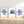 Watercolor paintings of minimalist seaweed and coral designs in deep navy blue add a touch of nature to a room with a light wood floor and white walls.
