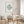 Mint green discus fish wall art in wooden frame – minimalist coastal print styled in modern dining room with light neutral decor