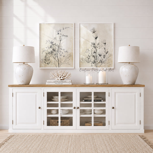 White sideboard with glass doors, two white lamps, and floralmodern farmhouse  wall art in a room.