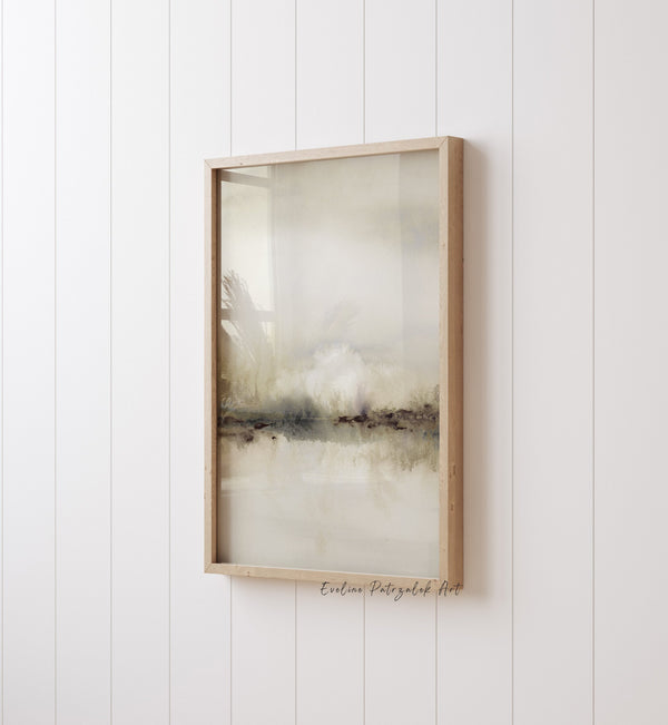Single beige abstract landscape print in a wooden frame on a white panelled wall