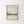 Abstract beige landscape print in a thin oak frame on a white wall