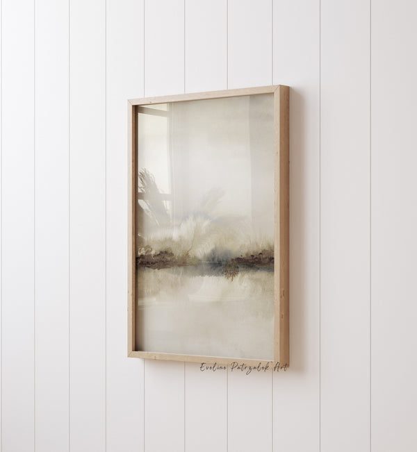 Close-up of a soft neutral landscape print with a dark shoreline and pale sky