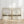 Neutral landscape wall art set of 2, beige watercolor prints with birds leaning against a white panelled wall