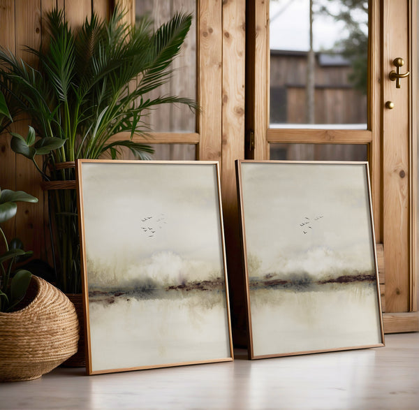 Beige landscape watercolor prints with birds leaning by a palm plant and a wooden door