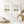 Neutral abstract landscape prints with birds in white frames above candles and a rattan tray