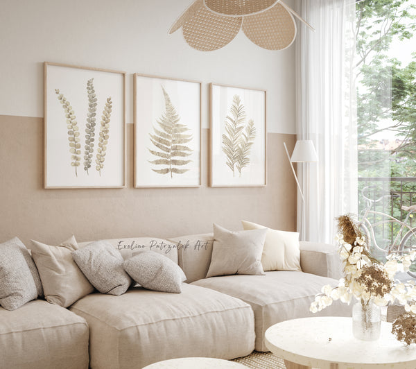 Beige sectional sofa in a living room with floral wall art and a lamp.