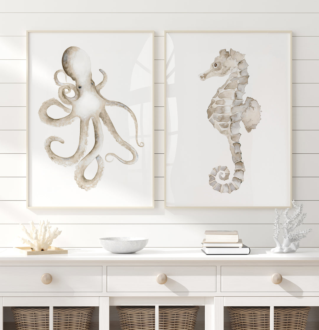 Neutral coastal interior decor with octopus and seahorse watercolor wall art, white console table, wicker baskets, coral accents, and natural beach house styling