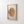 Single watercolor wood slice print with tree rings in a light wood frame