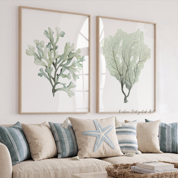 Green coral wall art set of 2 above a beige sofa with blue striped cushions