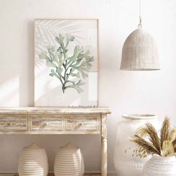 Sage green coral print on a rustic wooden console under a woven pendant lamp