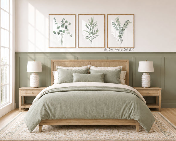Bedroom with a wooden bed, green bedding, and sage green botanical wall art wall art featuring plants.