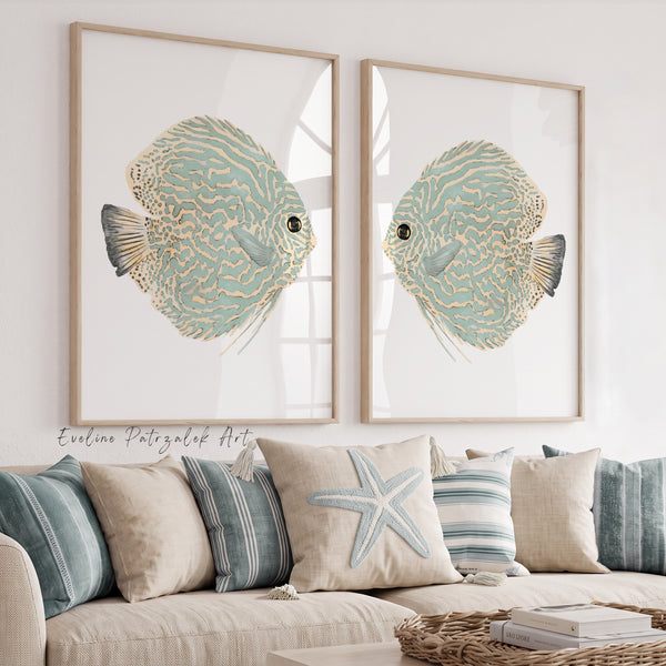 fish prints in sage green framed above sofa with 7 pillows