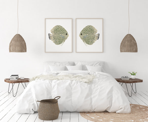Bedroom with white bedding, wooden nightstands, and framed fish artwork on a white wall.
