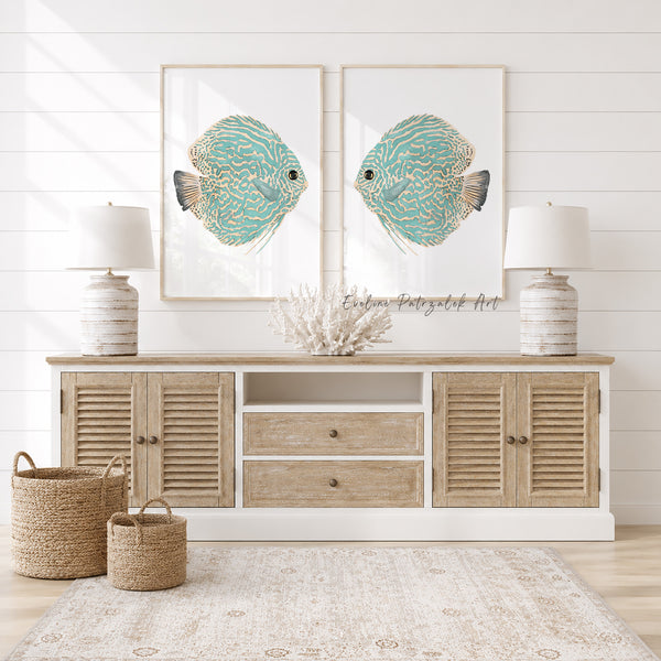 Wooden sideboard with fish artwork, lamps, and baskets in a room with white walls.