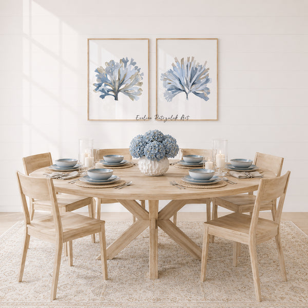 Dining room with wooden table and chairs, floral centerpiece, and framed artwork on the wall.