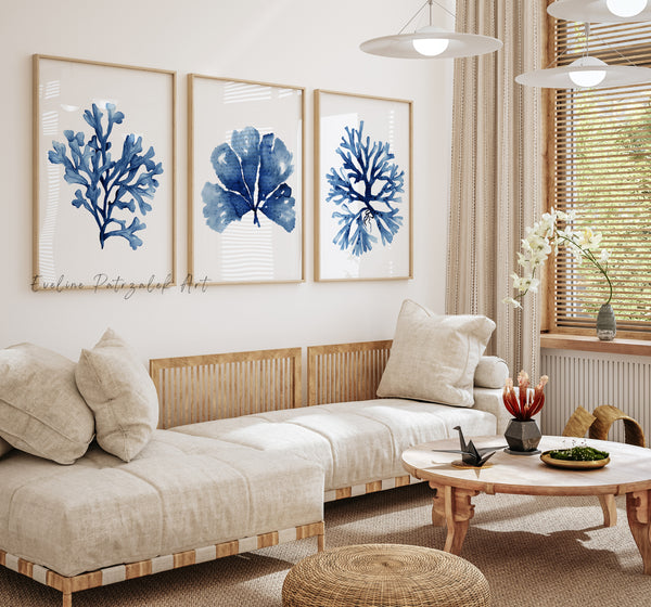 Living room with beige sofa, wooden coffee table, and blue coral art on the wall.