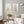 Set of 2 black and beige wildflower prints above a white sofa in a soft grey living room