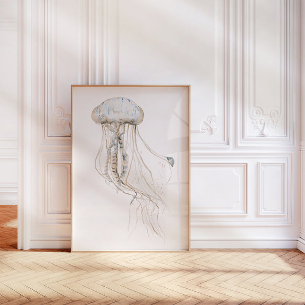 Large jellyfish print leaning against a white panelled wall on a herringbone floor
