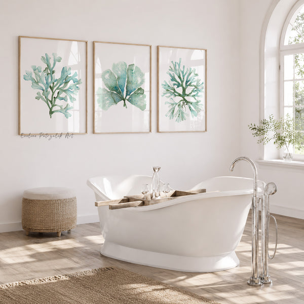 Bathroom with a freestanding bathtub, framed coral art, and natural light.