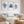 watercolor set of 3 minimalist blue corals put into wooden frames hang above white sofa