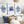 Watercolor paintings of minimalist seaweed and coral designs in deep navy blue add a touch of nature to a bedroom with blue and brown pillows and a white bed.