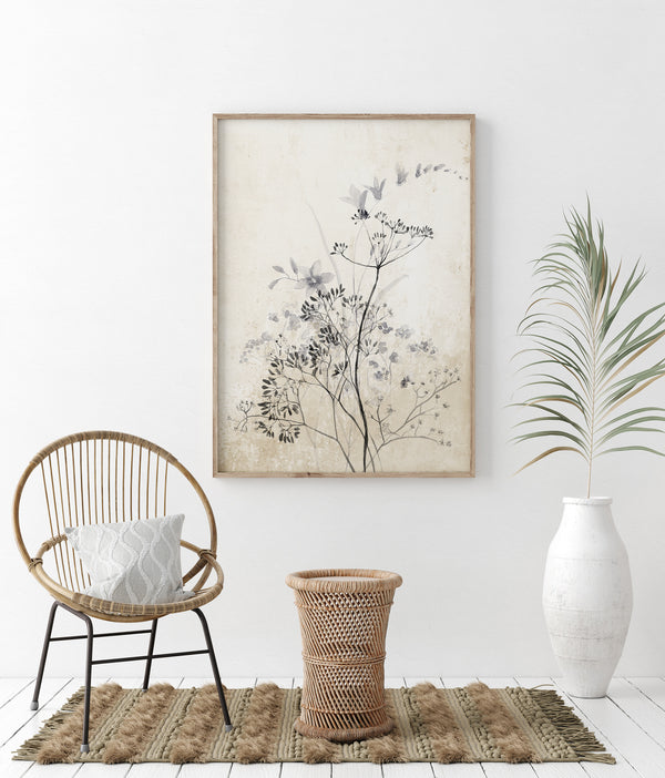 A botanical element capturing the beauty of nature's designs adds a touch of serenity to a minimalist living space with a rattan chair and woven accents.